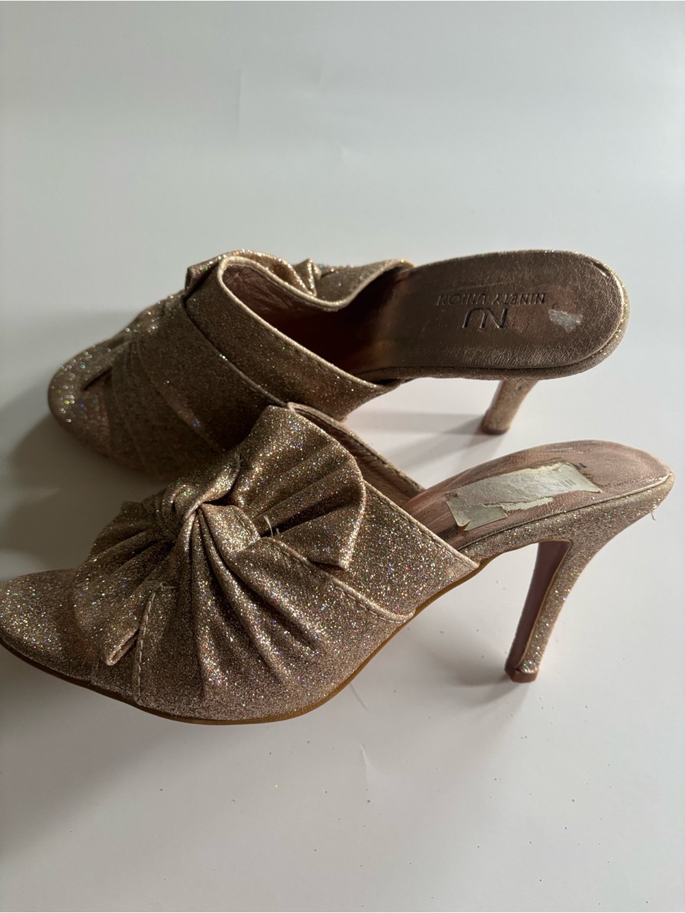 NU by Ninety Union Glitter Knot Mules in Rose Gold